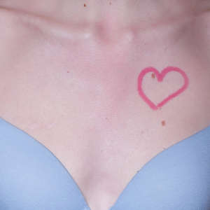Lipstick Heart on Woman's Chest